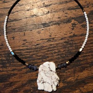 White buffalo chunk necklace.